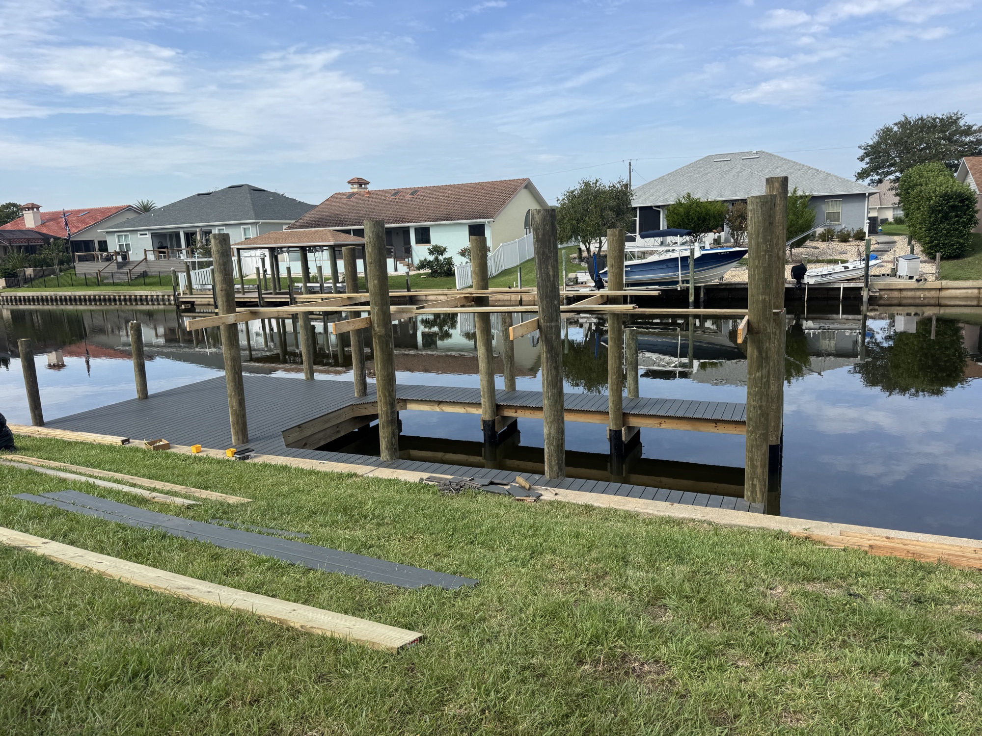 Mammoth dock under construction — composite decking being laid over canal