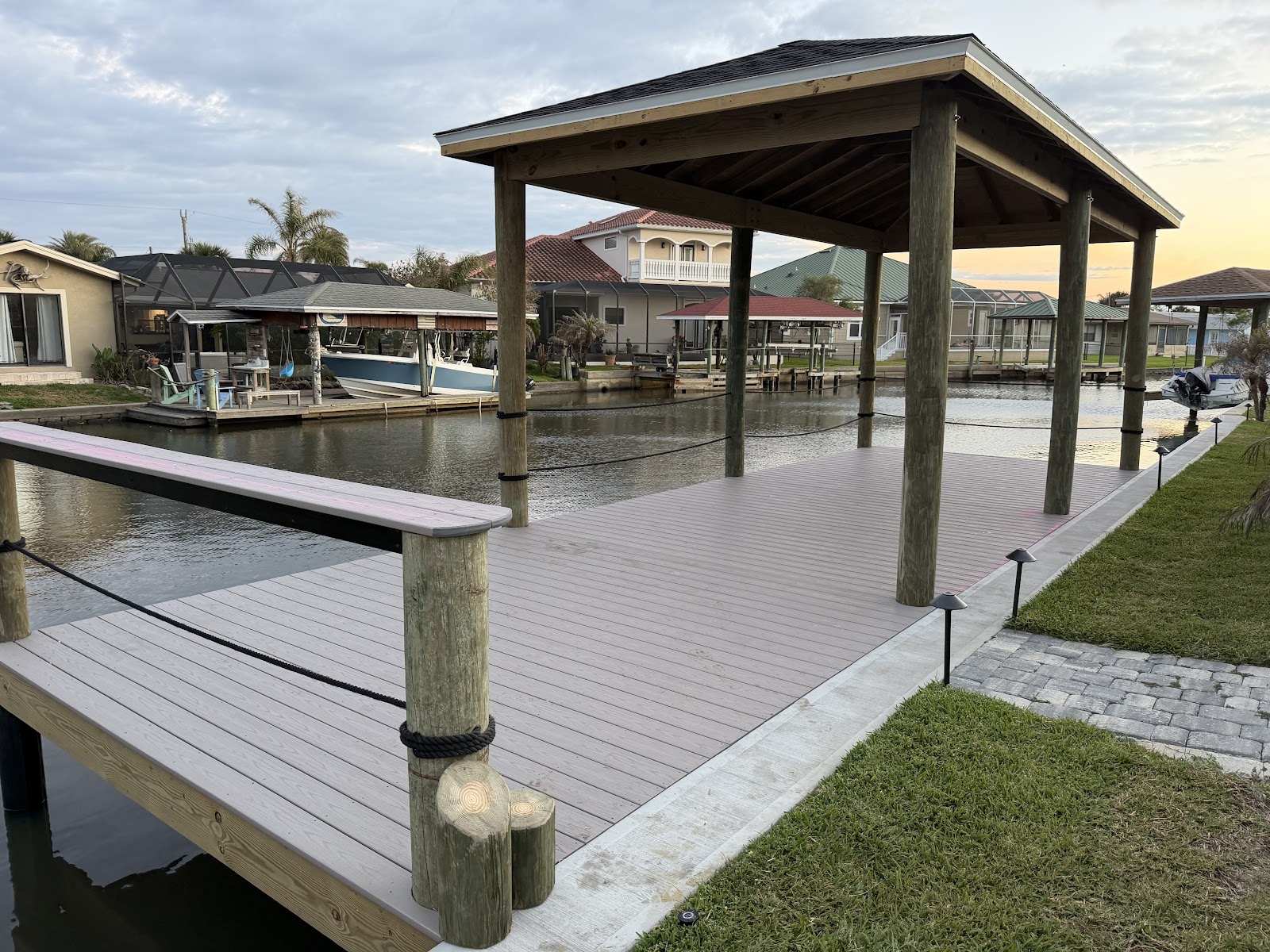 Finished covered dock with composite decking and rope-wrapped pilings, Flagler Beach FL