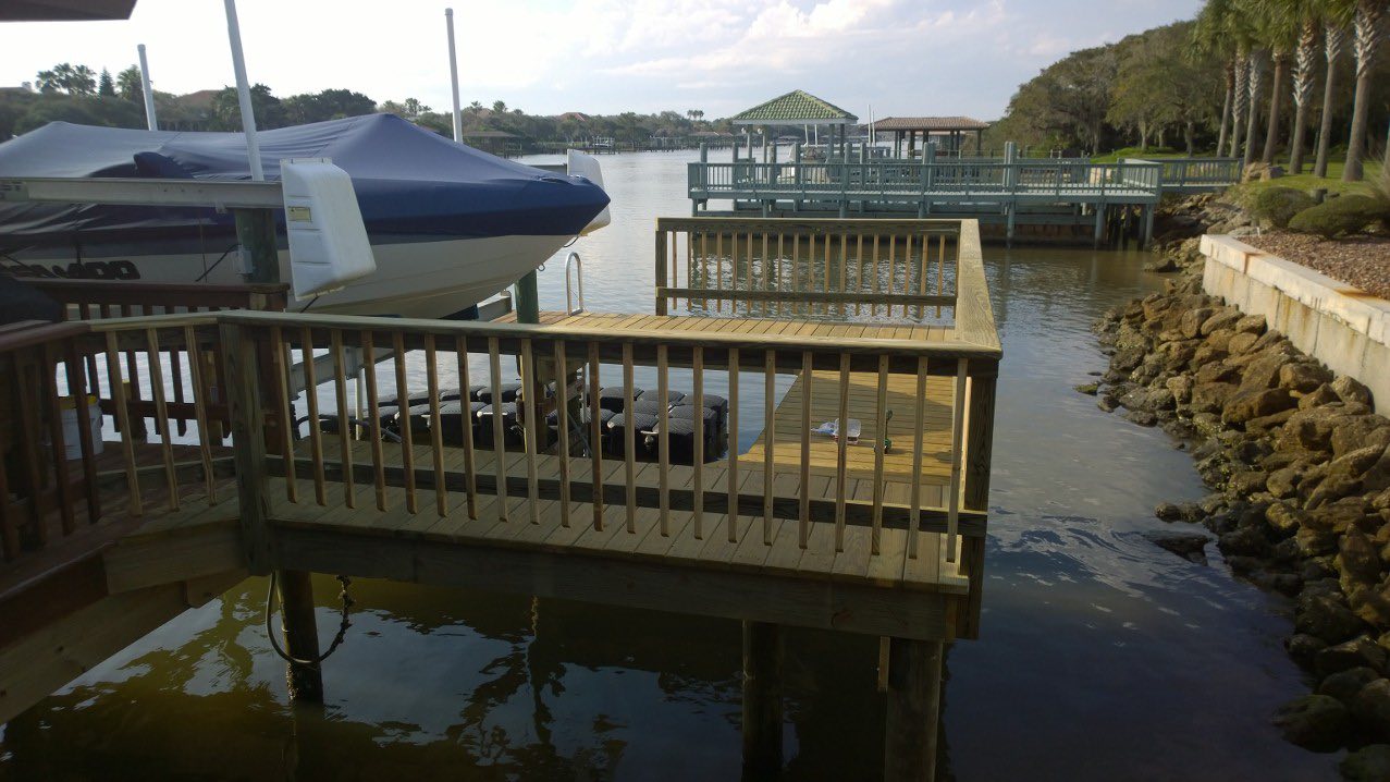 Completed dock with boat lift and covered jet ski, Flagler County