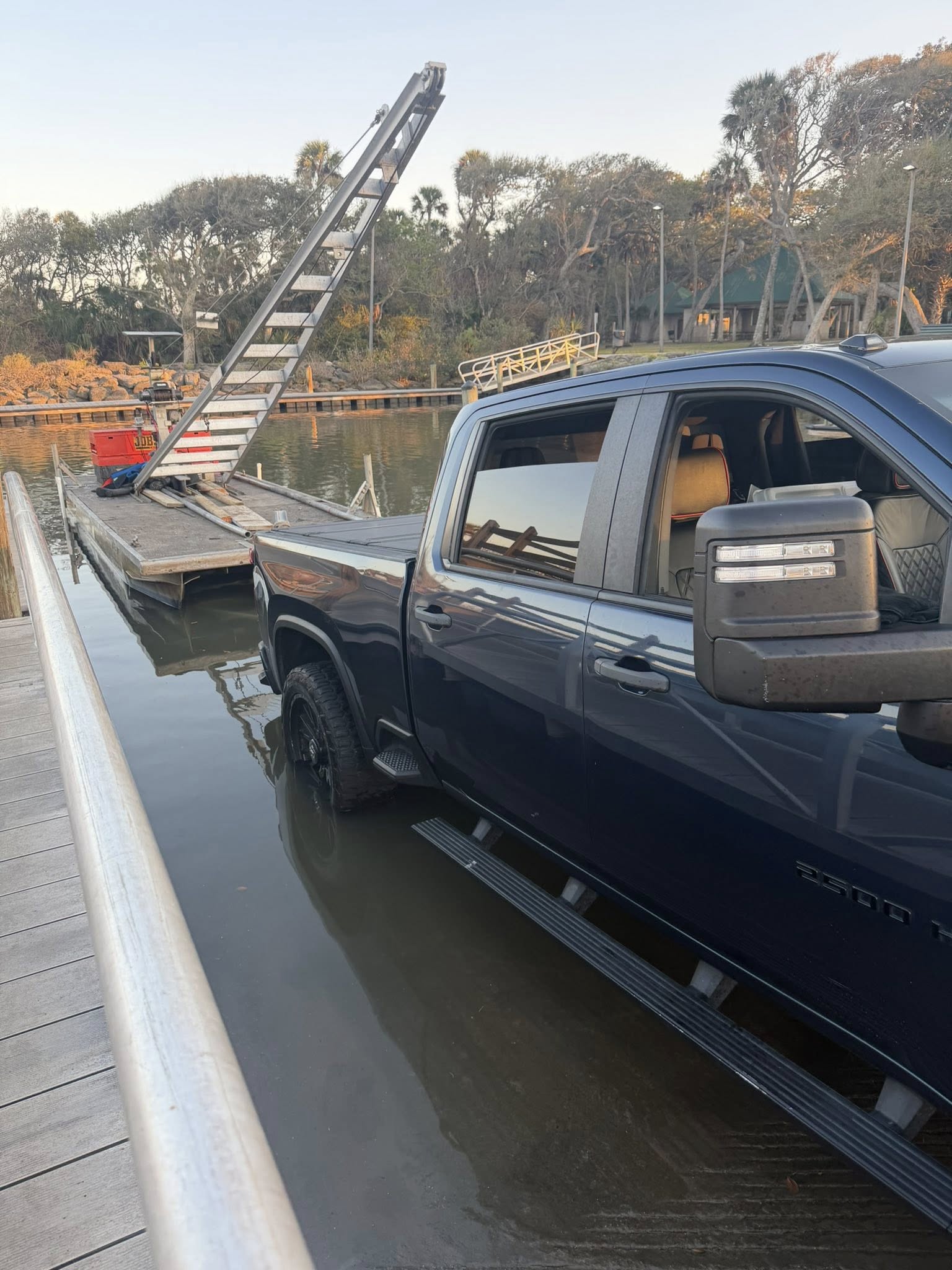 Work barge and crane at seawall repair project