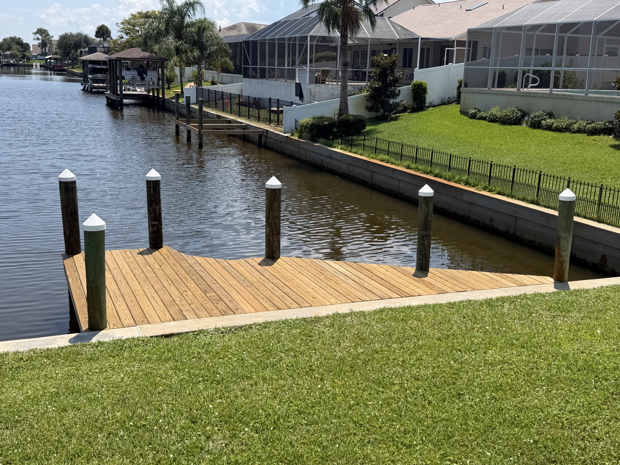 Resurrection dock — fresh pressure treated decking, new pile caps, Palm Coast FL
